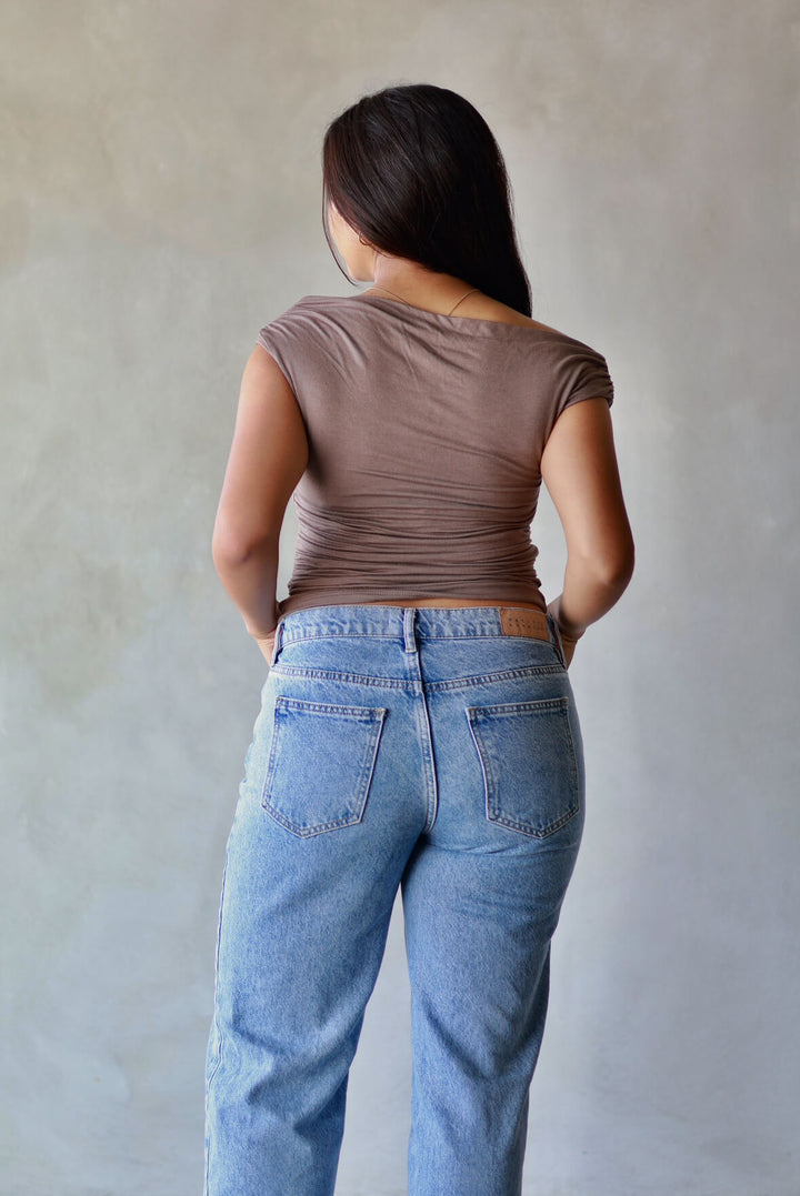 women's asymmetrical ruched top back view
