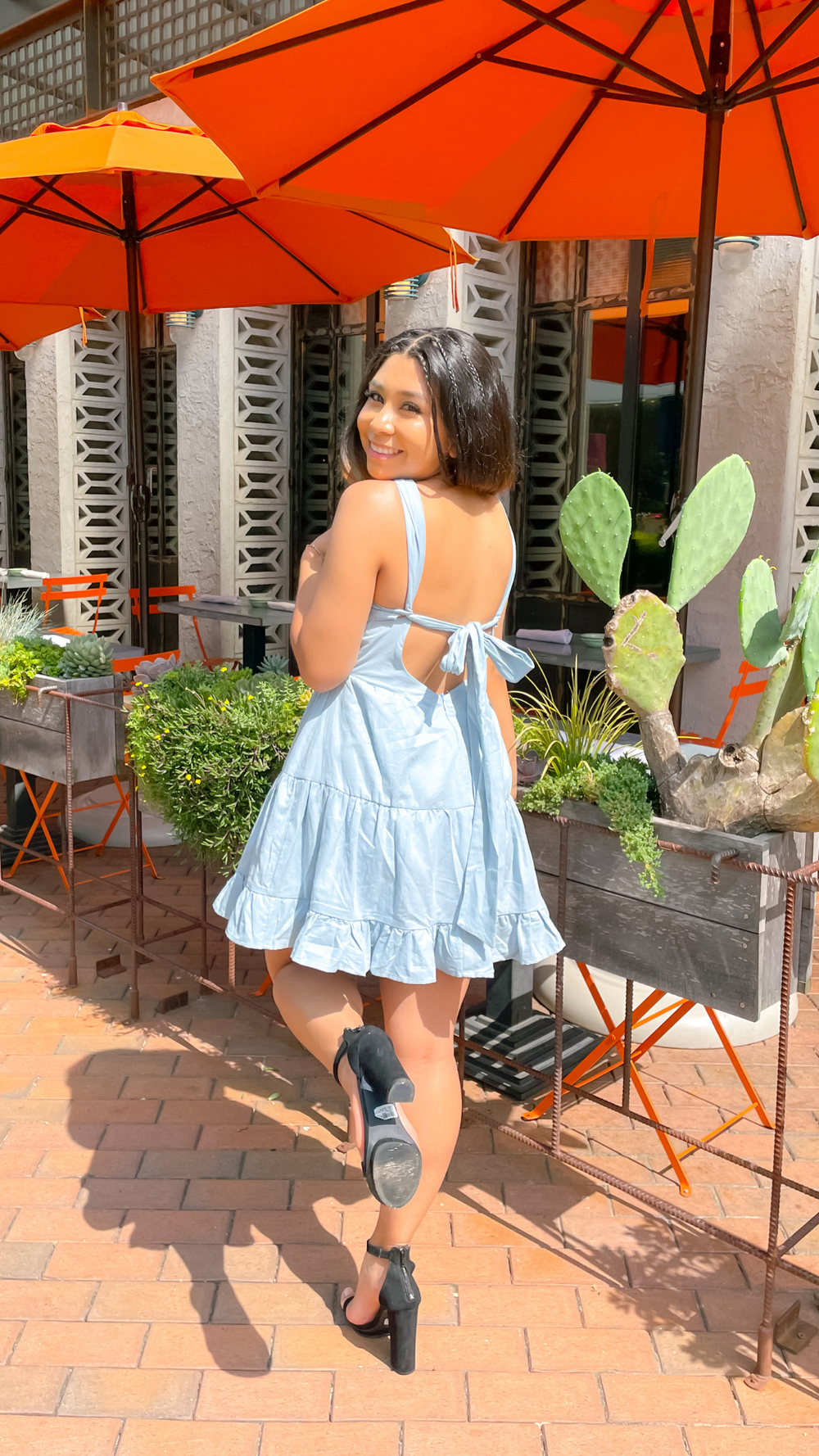 baby blue halter tie back dress that flows around the waist